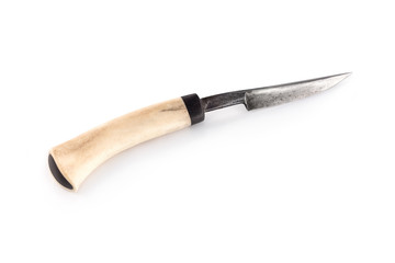 Isolated ancient hunting knife with wooden handle at white background.