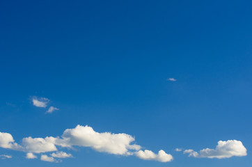 white fluffy clouds in the blue sky