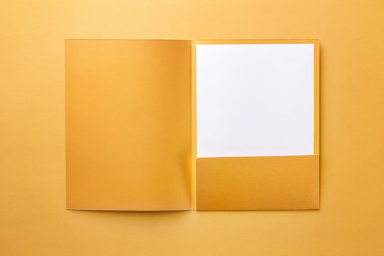 Corporate stationery set mockup. Presentation folder and letterhead at golden textured paper background.