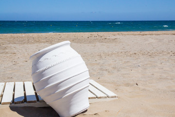 White ceramic vase at seacoast