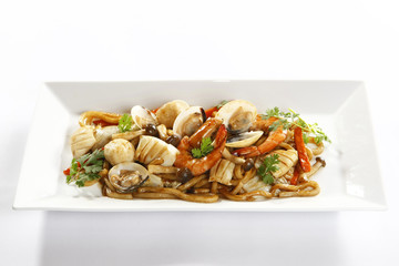 Sauteed seafood stuff with squid, clams, shrimp, mushoom and fish balls on white platter
