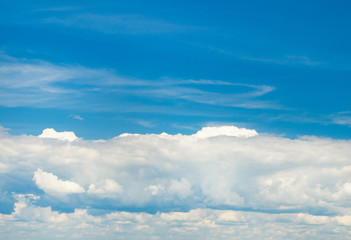 white fluffy clouds in the blue sky