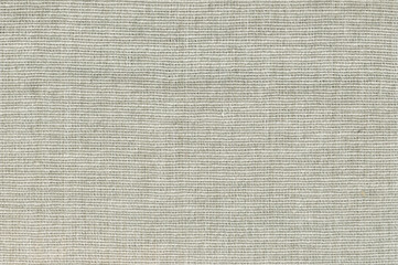 Green canvas textured background or wallpaper from rough fabric and a blank space