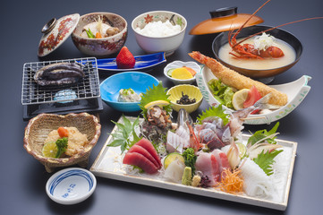 Japanese special meal with sushi tuna, shrimp, shell, fried fish, and seaweed soup