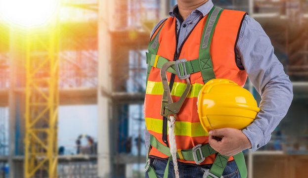 engineer wear fall arrest equipment on site  background