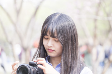 Beautiful girl taking a shot in spring time