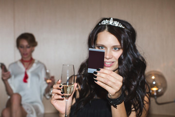 Woman looking at instant picture