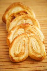 Headphones with apples cake on wooden tray
