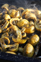 Grilled mushrooms with hot charcoal outdoor
