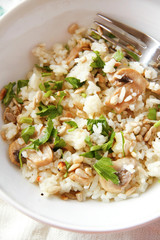 Oven fried rice with mushrooms in white bowl
