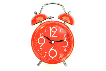 Red alarm clock on white background