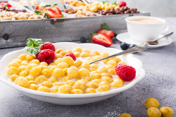 Healthy breakfast with cereal balls, fresh milk and berries, selective focus.