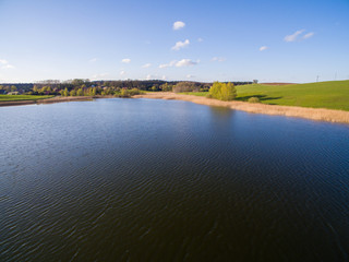 aerial view of a beautiful blue lake under blue sky - germany