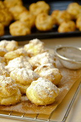 Wind cakes with mascarpone cheese filling in kitchen