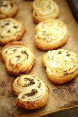 Salty headset with tapenade cake on wooden table