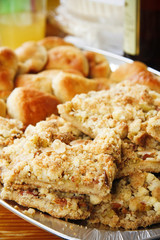 Rhubarb crumb cake with almond shavings on table