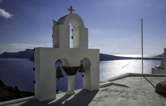 Traditional bell tower in Oia village, Santorini island, Greece