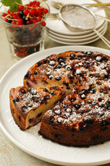 Ricotta cheese cake with berries on white dish