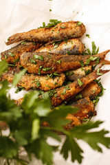 Easy fried marinated Herring fish on white dish