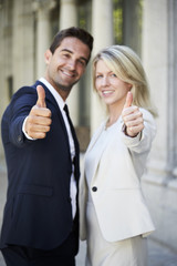 Thumbs up from business colleagues, portrait