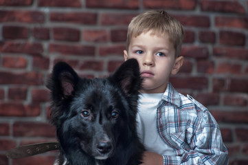 Little boy and black dog pooch
