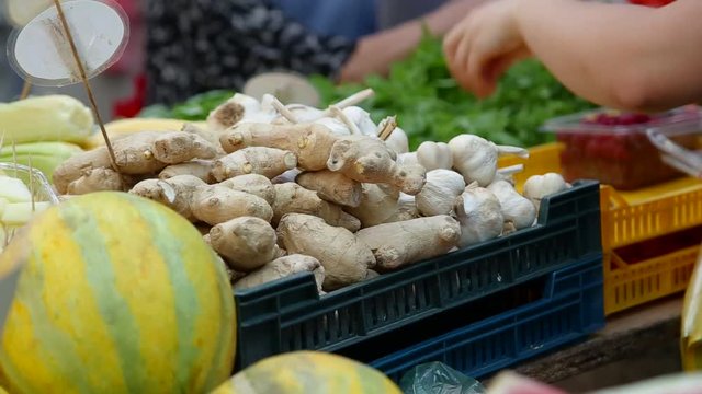 Fresh ginger in crates at the market