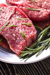 Beef steak with rosemary , salt and pepper.