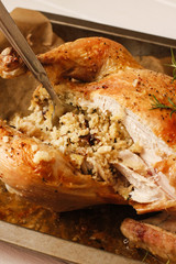 Stuffed chicken with spicy couscous on tray