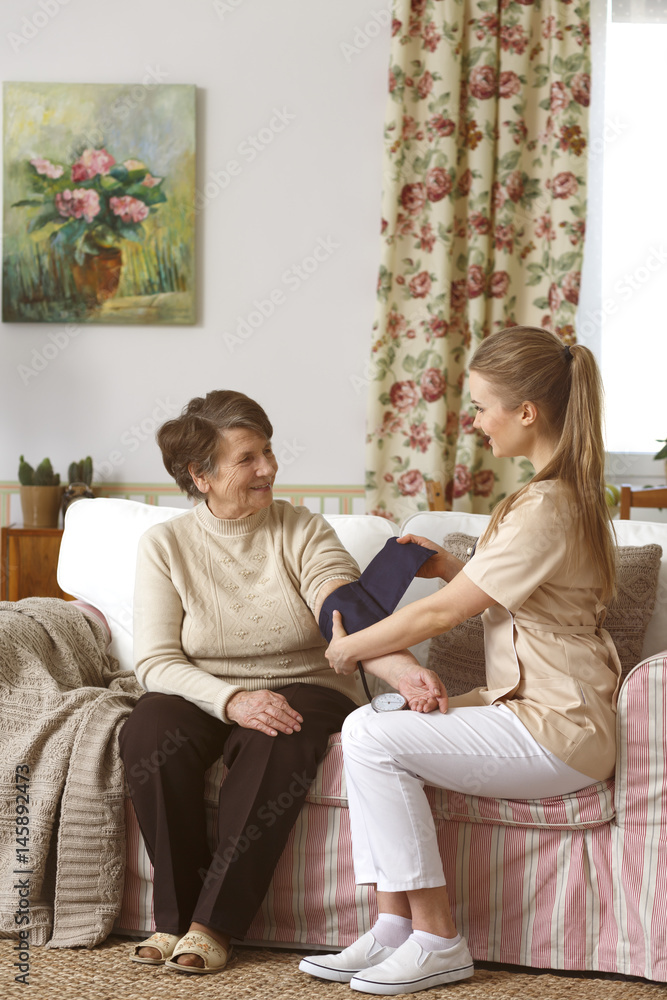 Canvas Prints Woman having blood pressure measured