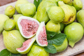 Ripe fig fruits on the wooden table.