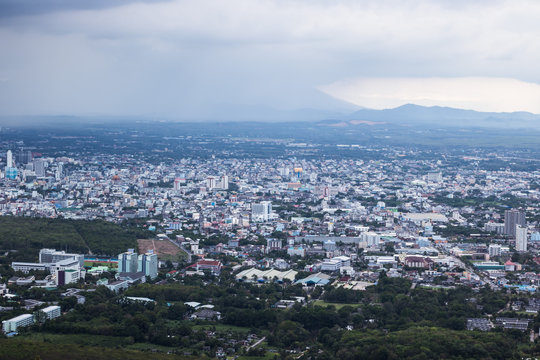 A view of the city from a window from a high point during a rain and Rain clouds at Thailand