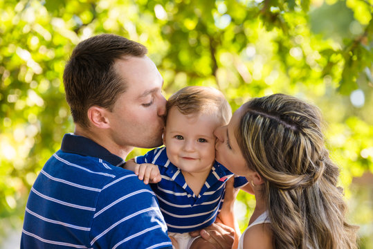 happy young family mother father son have fun in summer park