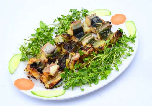 Grilled Catfish With Cucumber, Carrot And Herbs On White Platter