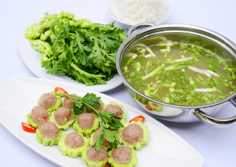 Prepared hot pot of fish ball with bitter melon on white platter