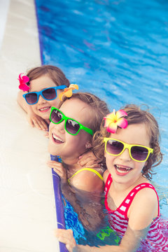 Happy children in the swimming pool