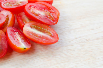 cherry tomatoes on wooden cutting board