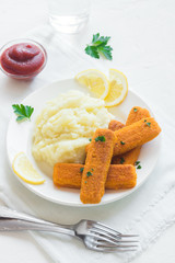 Fried fish fingers, mashed potatoes