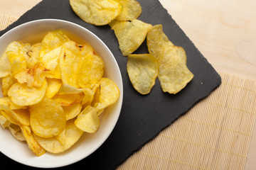 Potato chips in bowl on a table
