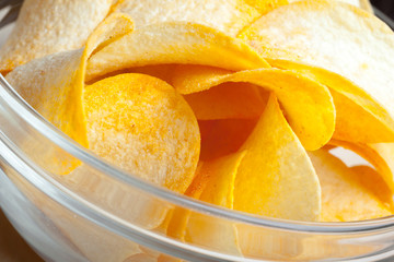 Potato chips in bowl on a table