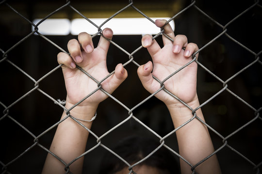 single girl child holding the cage was imprisoned make no freedom or lack of freedom