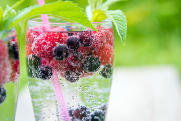 refreshing summer drink with sparkling water and fresh berries