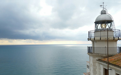 Fototapeta na wymiar Sea lighthouse on village in Peniscola, Castellon Spain