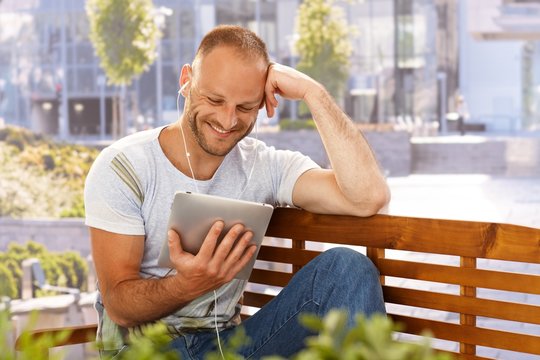 Happy man with e-book reader