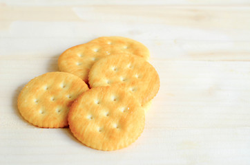 crisp wafer often eaten with cheese or other savory toppings.