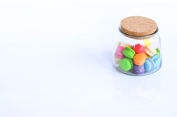 Colorful macaroon on white background, the sweet course eaten at the end of a meal.