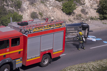 Fototapeta na wymiar Firefighters respond to a vehicle accident 