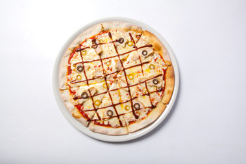 Italian delicious pizza with olive, cheese and ham.