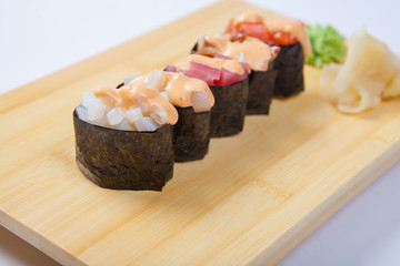 Sushi with salmon on a wooden tray