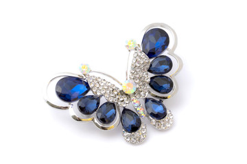 Blue brooch isolated on white background