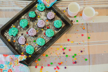 colorful cupcakes are on the tray